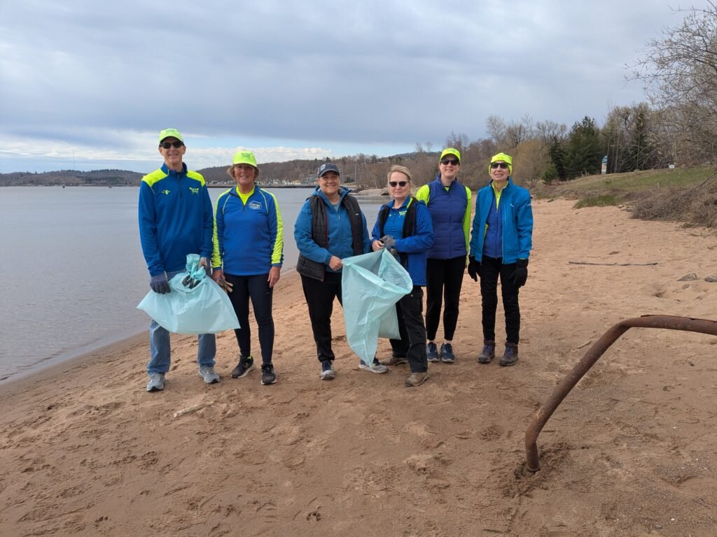 U.P. Rowing members cleaning up the Lake Superior shoreline during the Marquette Beautification & Restoration Spring Clean Up